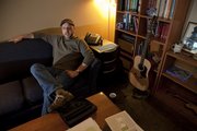 Rabbi Neal Schuster is the new senior Jewish educator to KU Hillel. The laid back leader uses a sofa and coffee table as a desk in his Hobbs Lofts office.