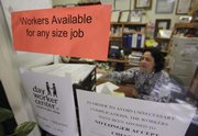 Maria Marroquin helps find jobs for unemployed workers Friday at the Day Worker Center of Mountain View, in Mountain View, Calif. The unemployment rate rose to 9.8 percent in September, the highest since June 1983, as employers cut far more jobs than expected.