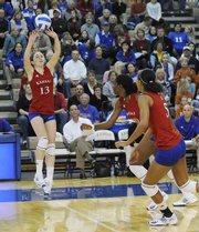 Nicole Tate (13) sets up Brittany Williams and Tayler Tolefree (5). Kansas was swept, 3-0, by Texas on Wednesday in Horejsi Family Athletic Center.