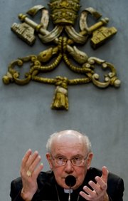 Cardinal William Levada, the Vatican’s chief doctrinal official, speaks Tuesday at a news conference at the Vatican. The Vatican has made it easier for Anglicans to join the Catholic Church, responding to the disillusionment of some Anglicans over the election of openly gay bishops and the blessing of same-sex unions.