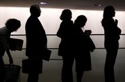 Job seekers join a line of hundreds of people at a job fair sponsored by Monster.com in New York in this March 5 file photo. Even with an economic revival, many U.S. jobs lost during the recession may be gone forever and a weak employment market could linger for years.