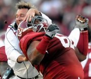 Alabama defensive coordinator Kirby Smart, left, celebrates with defensive lineman Terrence Cody after Cody blocked the first of two Tennessee field-goal attempts. Alabama held off Tennessee, 12-10, on Saturday in Tuscaloosa, Ala.
