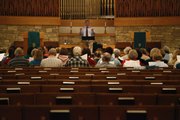 Nick Krug/Journal-World Photo. The Lawrence Civic Choir practices under the direction of Steve Eubanks Friday, Sept. 25, 2009 at First Baptist Church.