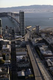 An empty Bay Bridge is shown in an aerial view Wednesday in San Francisco. The San Francisco-Oakland Bay Bridge has been closed indefinitely after a rod installed during last month’s emergency repairs snapped, causing a traffic nightmare for the 280,000 motorists who cross the landmark span every day.