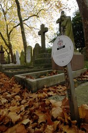 A sign indicates a burial plot for reuse Monday at the City of London Cemetery & Crematorium in east London. The British capital is quickly running out of places to bury people, with almost 8 million living and many millions more under the soil of a city that has been inhabited for 2,000 years.