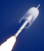A cone of moisture surrounds part of the Ares I-X rocket during liftoff Wednesday on a sub-orbital test flight from the Kennedy Space Center’s Launch Pad 39-B in Cape Canaveral, Fla. The rocket’s launch was delayed by weather several times.