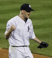 New York’s A.J. Burnett reacts after striking out Philadelphia’s Ryan Howard with two runners on base in the third inning. Burnett allowed one run in seven innings, and the Yankees defeated the Phillies, 3-1, on Thursday night in New York.