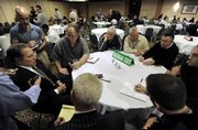 Michigan State coach Tom Izzo, left, talks to the media during the Big Ten Media Day on Thursday in Rosemont, Ill. The Spartans are ranked No. 2 in the preseason AP poll.