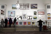 People view art from the failed banking giant Lehman Brothers on Friday at Freeman’s auction house in Philadelphia. The 200-plus pieces of modern and contemporary art scheduled to go up for bid on Sunday once lined the corridors and graced the board rooms of Lehman’s offices in New York, Boston and Wilmington, Del.