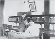 Professor C.G. Dunlap and Edith Charles, librarian in charge, work in the seminary room in the northeast corner of the Spooner Library’s basement in this undated photo.