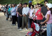 Hundreds of people wait for swine flu vaccination shots Monday in the City of Industry, Calif. Before Los Angeles County health officials stepped up screening at their flu clinics some people who aren’t at high risk for swine flu complications got the much-in-demand vaccine.