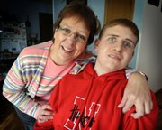 Jon Schoel, right, pictured Tuesday with his mother, Brenda Schoel, had wanted to play football at Nebraska. A virus when he was in the sixth grade at St. Mary’s Grade School, Salina, cut that dream short and drastically changed his life. The Overland Park-based Kansas City Dream Factory helped him achieve the next best thing: going to a game last Saturday in Lincoln, Neb., his first.
