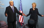 U.S. Secretary of State Hillary Rodham Clinton and Israeli Prime Minister Benjamin Netanyahu react during a press conference Saturday in Jerusalem. Clinton said Israel is making “unprecedented” concessions on West Bank settlement construction.