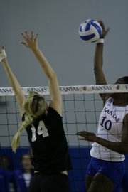 Kansas University’s Brittany Williams (10) attempts a spike at the net against Kansas State. The Jayhawks swept the Wildcats in three sets Wednesday at the Horejsi Center.