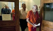 Burrell Mohler Sr. is escorted from the courtroom at Lafayette Hall in Lexington, Mo., following his first appearance on charges of child sexual abuse on Thursday.