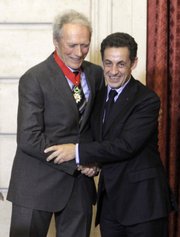 U.S. actor and director Clint Eastwood, left, shakes hands Friday with French President Nicolas Sarkozy after being awarded the “Commandeur de la Legion d’Honneur” (Commander of the Legion of Honor) at the Elysee Palace, in Paris.