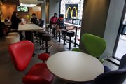 Customers visit a new McDonald’s featuring free Wi-Fi and an art deco, European-themed design in this Nov. 4 photo in New York. The restaurant is the first McDonald’s in the nation to undergo such a makeover.