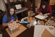 Althea Wilson and her step father Greg Thompson work on their structures to meet the entry deadline.