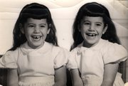 Alice and Mary Lieberman are not sure who’s who in this picture, taken in 1957. (Note the mirror image missing teeth.)