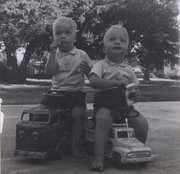 Bill and bob fleming enjoy a candy cigarette break together following an afternoon drive in the early ’1960s.