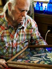 Ed Johann reflects on his Navy medals of honor in his Lincoln City, Ore., home. He earned the medals as a 17-year-old sailor on duty on Dec. 7, 1941, in Pearl Harbor, Hawaii.