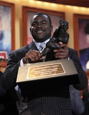 Alabama running back Mark Ingram holds up the Heisman Trophy after being named the winner Saturday in New York.