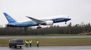 Boeing Co. employees cheer as a Boeing Co. 787 airplane takes off on its first flight Tuesday at Paine Field in Everett, Wash.