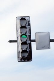 This photo provided by the Oswego, Ill., police was taken after a fatal crash April 6. Oswego police Detective Rob Sherwood said the wind had blown the snow over the red light, causing a driver to run the light and hit the vehicle of 34-year-old Lisa Richter, who was making a left turn. She was killed.