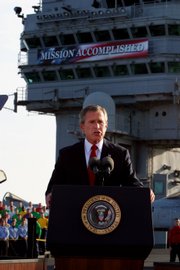 President George W. Bush declares the end of major combat in Iraq as he speaks aboard the aircraft carrier USS Abraham Lincoln off the California coast in this May 1, 2003, file photo.