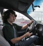 Driver’s ed student Elliot Nicholson, 15, drives a course Nov. 23 at Miami Killian Senior High School in Miami. Many schools around the country are cutting driver’s ed programs because of budget cuts.