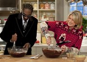 Martha Stewart makes brownies with Snoop Dogg during an appearance on “The Martha Stewart Show” Tuesday in New York in this publicity image released by The Martha Stewart Show. Nine of this year’s Crenshaw High School Cougars went through the Snoop Youth Football League, and the rapper is seen as a savior of sorts for football in an impoverished area of Los Angeles where gangs roam many of the streets.
