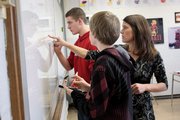 Lawrence High School Girls Volleyball Coach Stephanie Magnuson teaches a math class. The director for health at the Kansas Department of Health and Environment says that high schoolers should start school later to help prevent sleep deprivation.