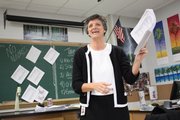 Lawrence High School Anatomy Teacher Jo Huntsinger hands out review sheets for finals. Huntsinger, a 1978 LHS grad, says that she was initially intimidated by the prospect of teaching alongside her former professors. "You learn what works and doesn’t work for your personality, and by making mistakes,” she says.