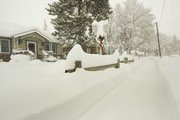 A sidewalk is covered in snow in this Dec. 18, 2008, file photo. Though the song “White Christmas” has led many Americans to hope for a snowy holiday, some cities have a better chance than others, according to weather experts.
