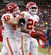 Kansas City running back Jamaal Charles (25) is congratulated by Mike Cox after Charles’ third-quarter touchdown. Charles rushed for 259 yards in the Chiefs’ 44-24 victory over the Broncos on Sunday in Denver.