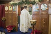 Rev. Michael Medis stands at the entrance of the iconostasis that separates the nave from the sanctuary, while he leads a worship service at St. Sophia Orthodox Church, Sunday, Jan. 10, 2010.