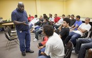 Craig Butler leads a discussion with a group of Free State students in this September 2009 photo. The Can We Talk group is expanding into Central Junior High School next month, and its founders would like to eventually have the program in elementary schools.
