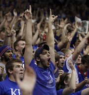 University of Kansas sophomore Reid Carter, center, Overland Park, gets into the spirit of the game before the Jayhawks tip off against Baylor, Wednesday, Jan. 20, 2010 at Allen Fieldhouse.