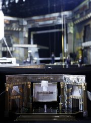 A model of the stage that will be used for Screen Actors Guild Awards is seen as crew members construct the stage in the background Wednesday in Los Angeles. The Screen Actors Guild Awards will take place Saturday.