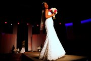 A model shows off a wedding dress during a fashion show in the Free State Bridal Show on Saturday, Jan. 16, 2010, at the Granada.