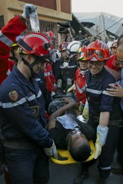 A 23-year-old man is rescued Saturday by a French search and rescue team after being trapped in the rubble of a fruit and vegetable shop for 11 days after the massive earthquake in Port-au-Prince, Haiti.