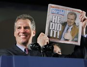 Sen.-elect Scott Brown, R-Mass. holds up a Boston Herald newspaper during his victory party Tuesday in Boston. Republican Brown’s win of the Democrats’ 60th Senate seat has brought President Barack Obama’s health care overhaul to a defining moment.