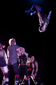 Jun Kuribayashi flips in the air during a Pilobolus performance at the Joyce Theater in New York City.