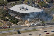 Smoke billows from an Internal Revenue Service building Thursday in Austin, Texas. Authorities think software engineer Joseph Stack launched a suicide attack on the agency by crashing his small plane into the building.