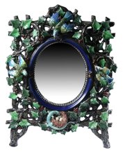Ivy-covered tree branches with birds and a nest surround this 22-by-16-inch mirror. The majolica frame was made by Hugo Lonitz, who worked in Germany between 1886 and 1904. It brought $3,824 at a Sloans & Kenyon auction in Chevy Chase, Md.