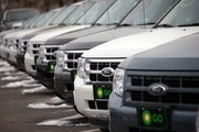 2010 Ford Escapes sit Sunday at a Ford dealership in Littleton, Colo. Ford Motor Co. said Tuesday that its U.S. sales jumped 43 percent in February thanks to strong demand for its cars. It said it grabbed some sales from Toyota.