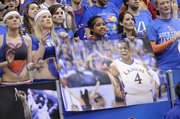 KU fans pull down posters of Sherron Collins at the end of KU's 82-65 win over the the Kansas State Wildcats Wednesday, March 3, 2010 at Allen Fieldhouse.