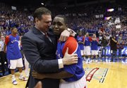 Kansas senior point guard Sherron Collins gets an emotional hug from head coach Bill Self as he is honored by the Allen Fieldhouse crowd before tipping off against Kansas State, Wednesday, March 3, 2010.