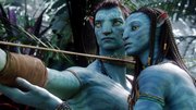 In this file film publicity image from “Avatar” released by 20th Century Fox, the character Neytiri, voiced by Zoe Saldana, right, works with the character Jake, voiced by Sam Worthington.