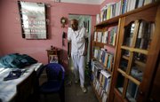 Cuban dissident Guillermo Farinas walks inside his home after an interview with The Associated Press on Friday in Santa Clara, Cuba. Farinas has been refusing food and water for more than a week to protest the Feb. 23 death of another hunger striking dissident, Orlando Zapata Tamayo. Farinas is also demanding the release of 26 political prisoners who are in poor health.